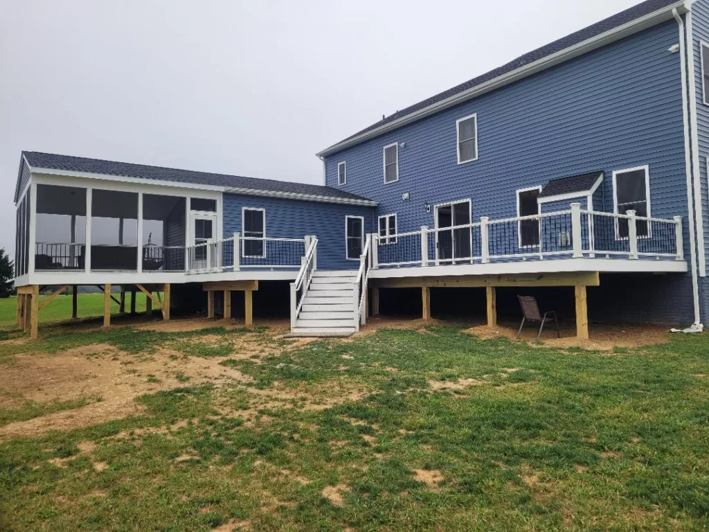 archway large deck roofed covered open screened-in stairs entire view