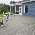 archway deck blue house roofed covered screened-in open concept stairs