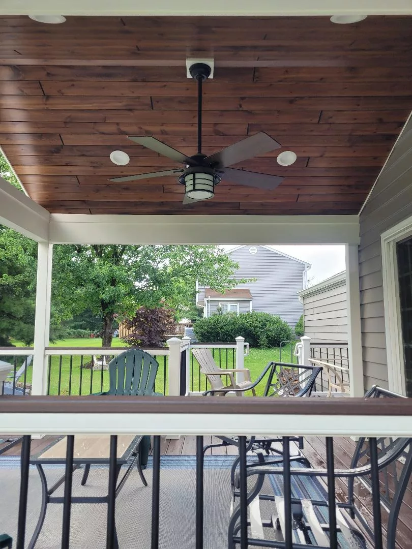 archway roofed deck wood ceiling fan backyard table chair